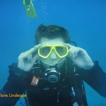 Darryl the divemaster dons a mask he found on the reef