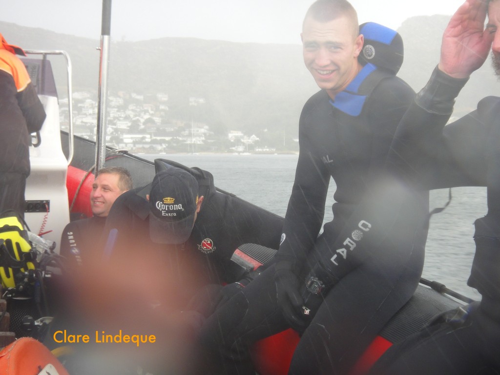 Andrew sitting it out while others crouch for shelter