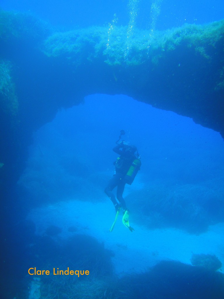 Tony under the arch at Cirkewwa