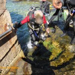 Tony climbing out of the water (behind a water droplet)