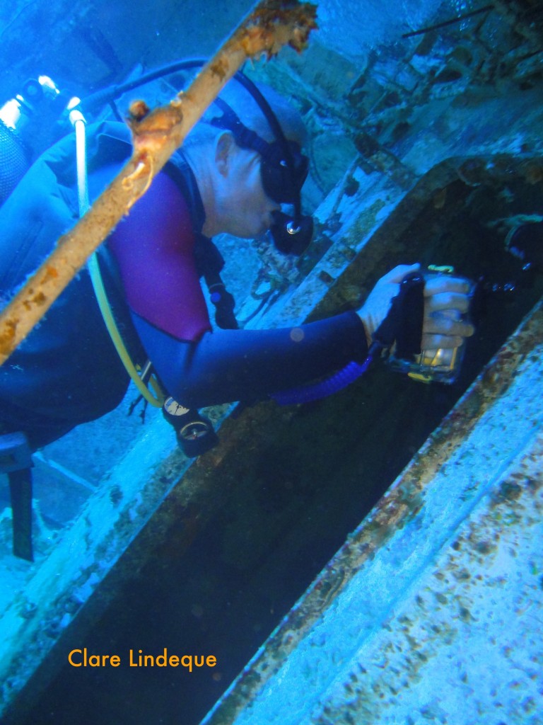 Tony filming something inside the wreck