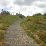 The path leading down from the parking area to the beach