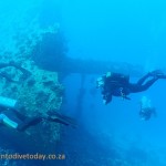 Divers rounding the bow