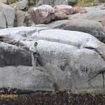 A fisherman on the rocks in the nature reserve