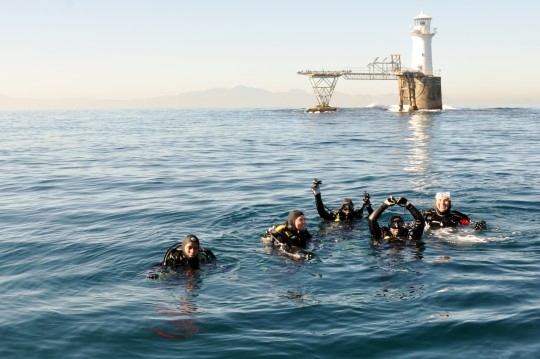 Divers on the surface at Roman Rock