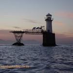 Roman Rock lighthouse at sunrise